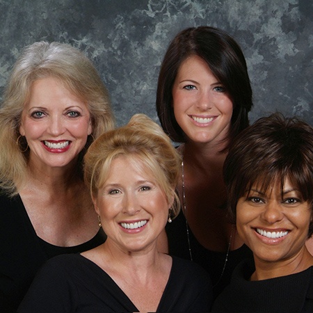 Four women with flawless smiles after visiting Rancho Bernardo dental office