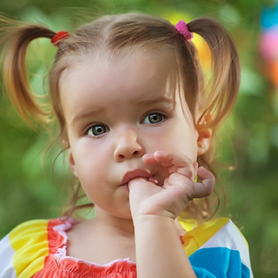 Toddler sucking her thumb