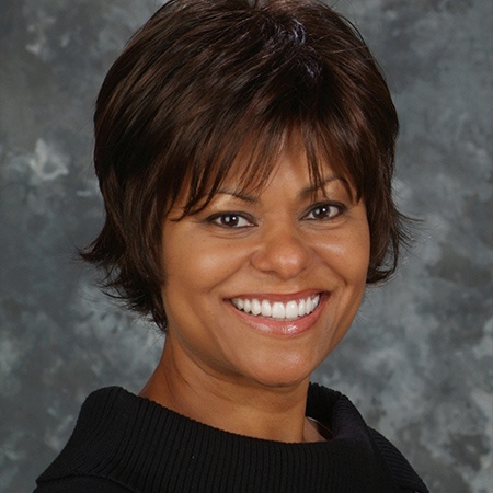 Woman with flawless smile after cosmetic dentistry in Rancho Bernardo