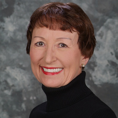 Woman smiling after restorative dentistry in Rancho Bernardo