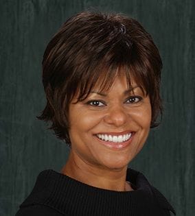 Woman smiling after receiving dental services in Rancho Bernardo