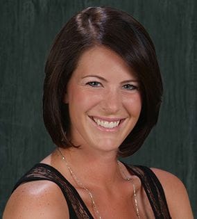 Smiling woman with brown bob haircut