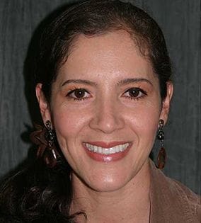 Woman with brown ponytail smiling