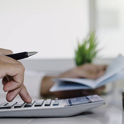 Man calculating cost of veneers in San Diego