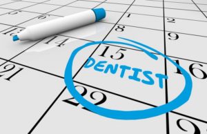 date of dental checkup circled in blue on calendar 