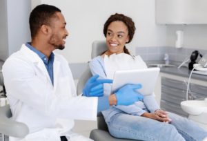 patient talking to a cosmetic dentist