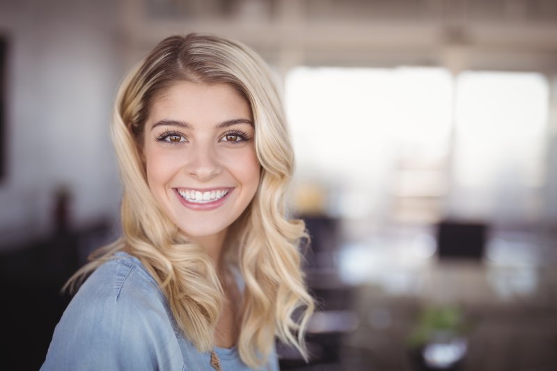 a woman showing the benefits of smiling in Rancho Bernardo