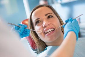 a person having their gums inspected 