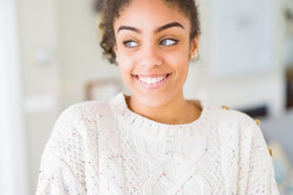 person smiling after being treated by cosmetic dentist