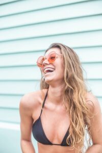 Laughing woman in bathing suit